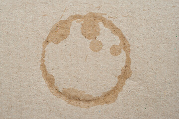 Cardboard texture with wet spots. Brown cardboard with round wet water stains. Crumpled cardboard with surface texture