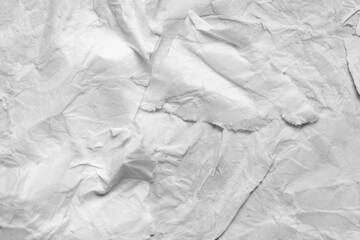 Wet torn paper texture. Blank torn sheet of wet white paper with crumpled surface texture. Paper background