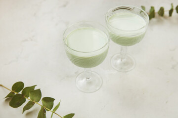 Aesthetic green healthy cocktails. Low alcohol, zero proof drinks. Natural light.