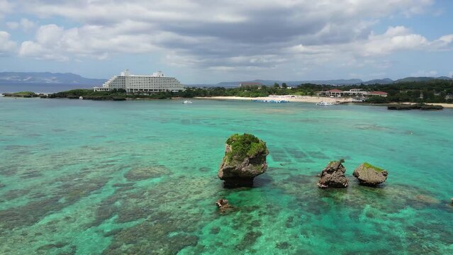Okinawa, Japan: Aerial drone footage of the Tobera Rock near by the Manzamo coast in Naha in Okinawa in Japan in the Pacific Ocean. 