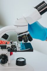 scientist conducting research with microscope