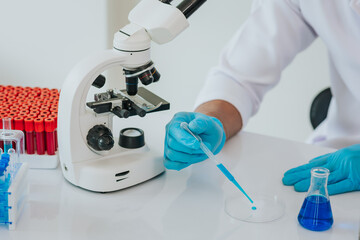 scientist conducting research with microscope