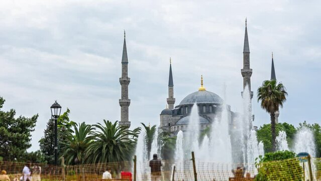 blue mosque in istanbul, timelapse, tourists walking by the fountain