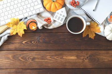 Autumn background with leafs cup of coffee and notepad