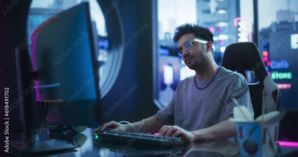 Wall mural creative multiethnic man using desktop computer in a futuristic high tech office space. young handso