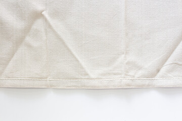 Abstract background, off white folded cotton cloth texture on white background with copy space