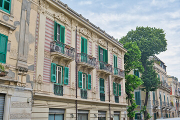 typical old house facade in messina , sicily in southern italy