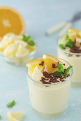Orange lemon citrus milk mousse in glasses	