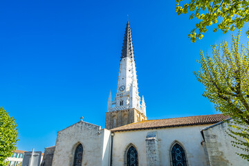 Church of Ars-en-Ré and its black and white bell tower in France