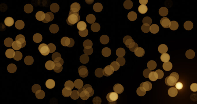 Beautiful abstract shiny light and gold glitter bokeh isolated on black background. 3d rendering