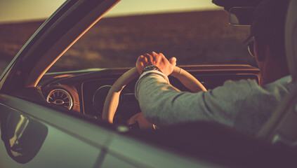 Summer Road Trip Behind a Convertible Car Wheel