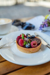 Breakfast time, Dessert with Raspberries and Blueberries, Coffee, and Magazine