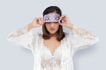 Asian woman take off a sleeping mask