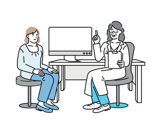 A woman being seen by a doctor in a hospital