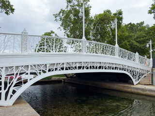 Beautiful small white bridge in the park.Nobody