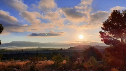 Naklejka na ściany i meble Setting sun on mountain range, Sax, Alicante, Spain
