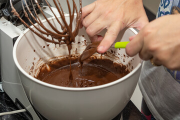 woman preparing brownie in a mixer. homemade chocolate brownie
