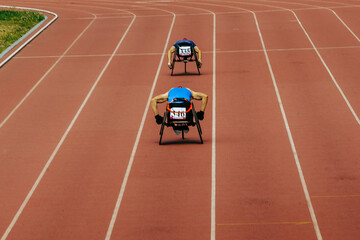 two athletes in wheelchair racing race track stadium in para athletics championship, summer sports games