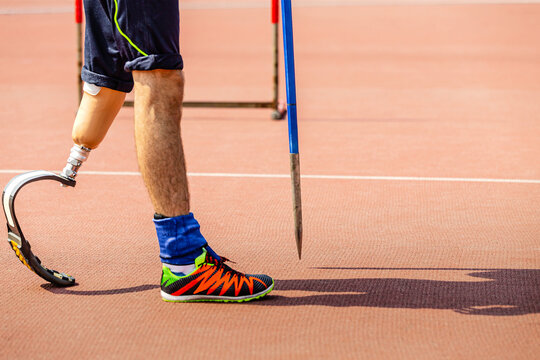leg on prosthesis male athlete with spear at athletics championships, summer para sports games