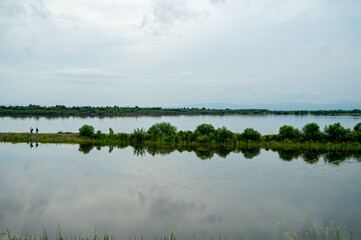 a narrow piece of road from land washed on both sides by water