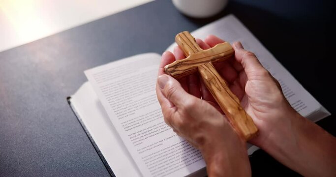 Sunlight Falling On Hand Over Bible