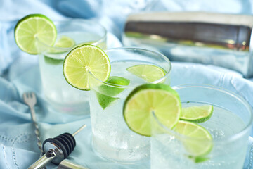 Three glasses of a freshly prepared gin and tonic