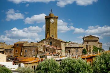 Fototapeta na wymiar Marta,Italy-06202023:Panorama over the village of Marta on Lake Bolsena note the 13th century clock tower Viterbo Italy