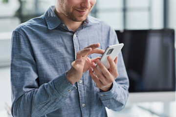 close up.a businessman uses a smartphone. people and technology