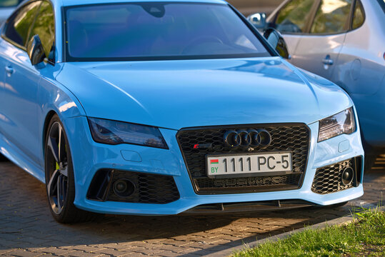 Minsk, Belarus. Apr 30, 2023. Audi RS 7 Sportback premium blue car parked on city street. Audi RS7 Sportback on parking lot, front grille and led headlight