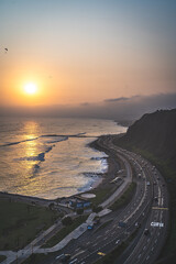 Winding road during the Sunset in la Costa Verde (Green Coast) in Lima, Peru (translation:  