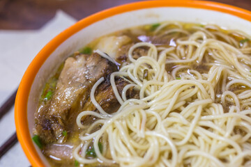 Close-up on Noodle Soup with Pork in a Bowl