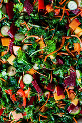 Fototapeta na wymiar Colorful salad with beet, carrot, zucchini and leafy green