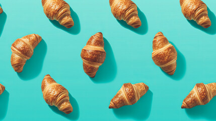 Delicious freshly baked crispy croissants on a turquoise minimal background. Flatlay pattern. Generative AI.