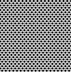 Seamless vector texture in the form of small and large black polka dots on a white background