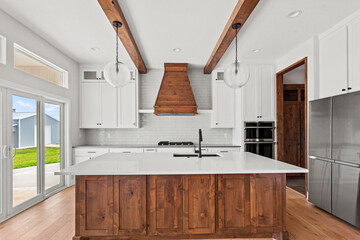 brand new white kitchen counter tops and raw stained wood cabinets and kitchen island. 