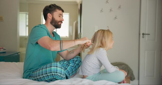 Girl, dad with brush and learning hair care, grooming and quality time with daughter and father in bedroom. Morning, routine and parent to support, teach and help child or bonding together on bed