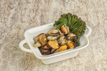 Tasty marinated mussels in the bowl