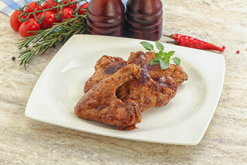 Roasted chicken wings with spicy sauce