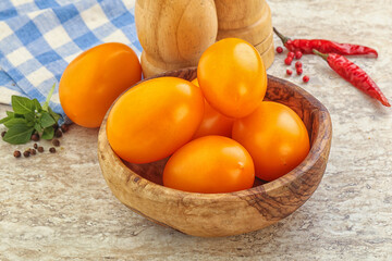 Sweet ripe yellow tomato in the bowl