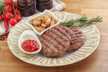 Grilled beef burger cutlet with sauce