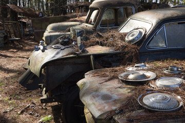 Old rusty car in a junk yard