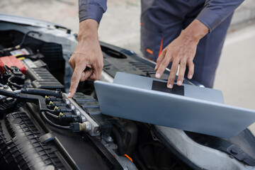 Obraz na płótnie Canvas car mechanic working Engine repair and maintenance service