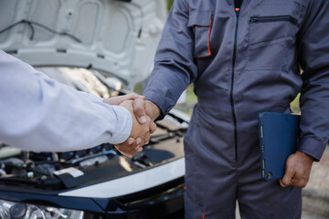 Customers shake hand with car insurance agents to enter into friendly terms and conditions, Car...