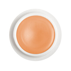 Organic nourishing scented lip balm in fruity orange colour, round compact packaging. Isolated on...