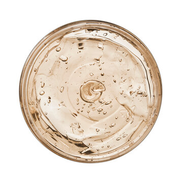 Beautiful fresh cooling gel texture closeup in round container from top view, isolated from background. Glycerin gel texture. Liquid aloe gel moisturizer with bubbles macro details