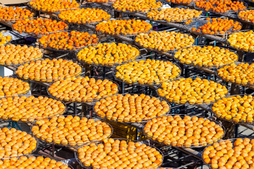 Peeled persimmons drying at outdoor