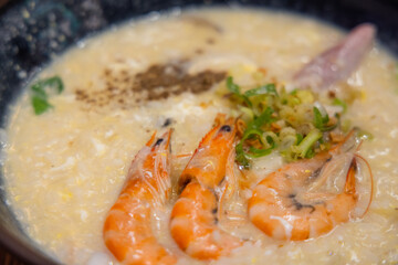 Seafood shrimp congee rice bowl in restaurant