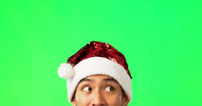 Man, face and Christmas hat by green screen, thinking and looking in holiday fashion, promotion or mockup space. Guy, headshot and xmas clothes for festive celebration, search and ideas by background