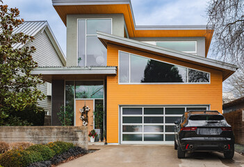New big custom made luxury house with driveway to garage in British Columbia. A modern and...