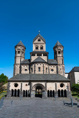 Fototapeta na wymiar The abbey of maria laach in germany on a sunny day with blue sky